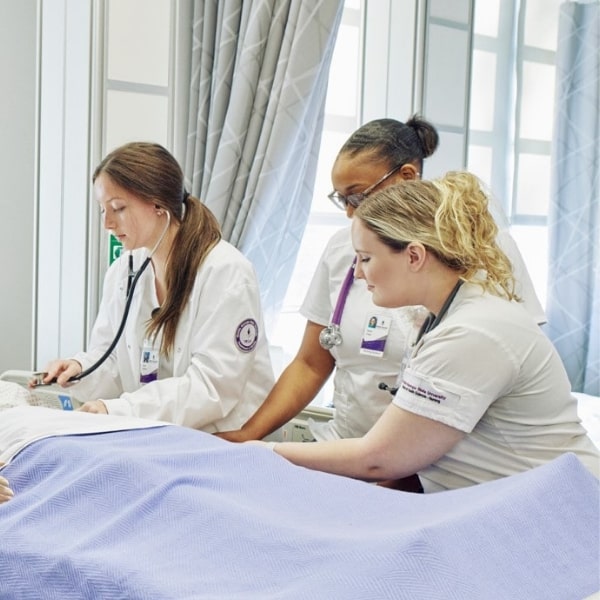 Three nursing students in class