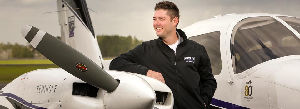 A student with an airplane