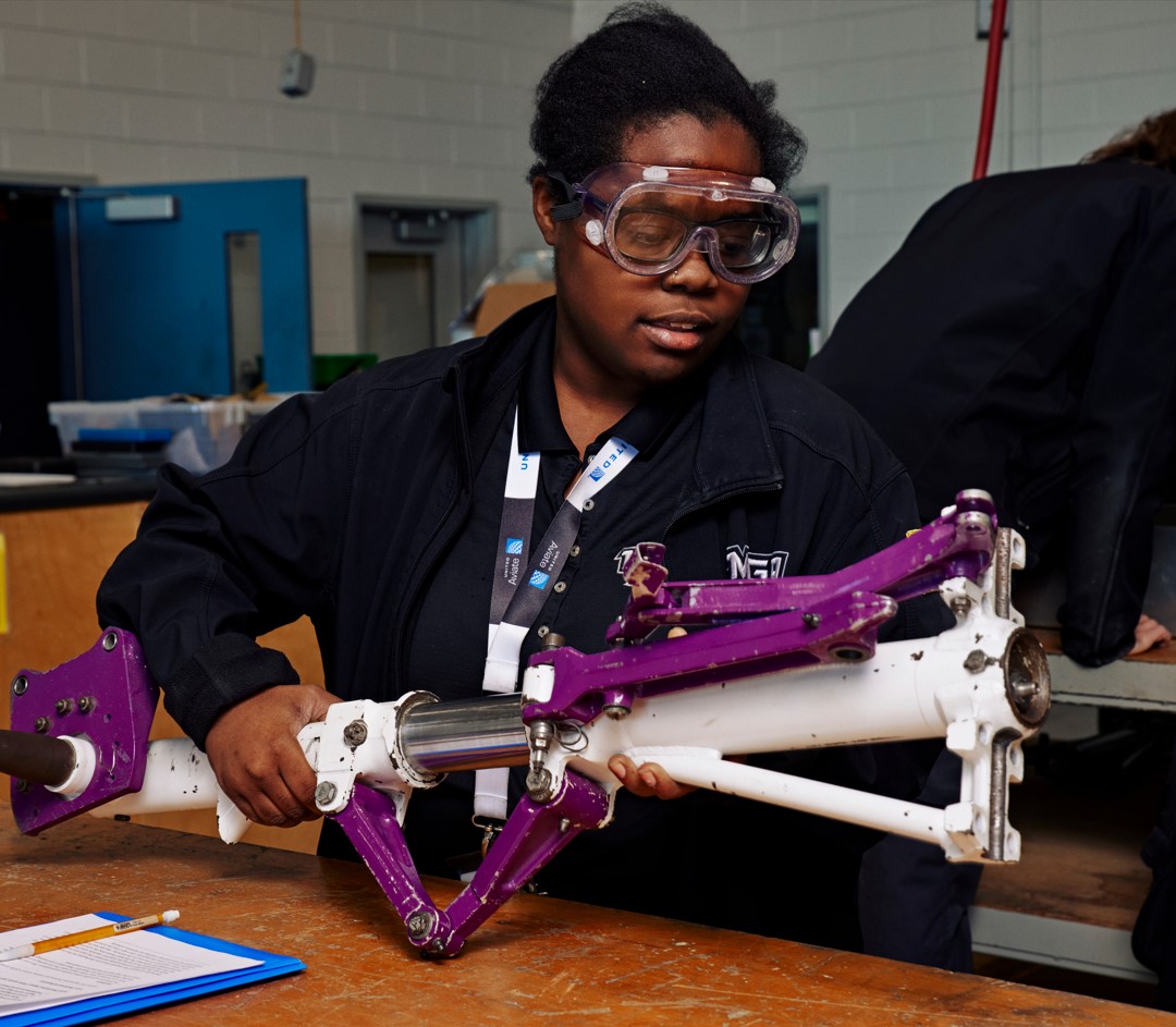 An Aviation student working on aircraft equipment