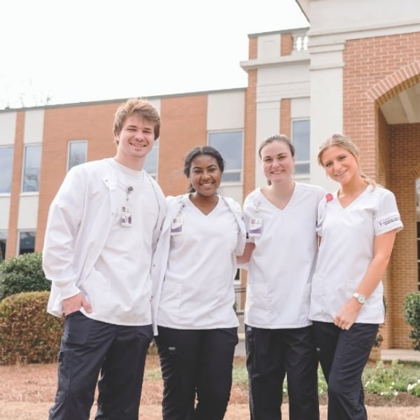 Four Nursing students smiling at the Dublin Campus