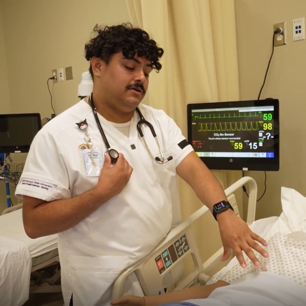 Student demonstrating proper equipment use at the Warner Robins Nursing lab