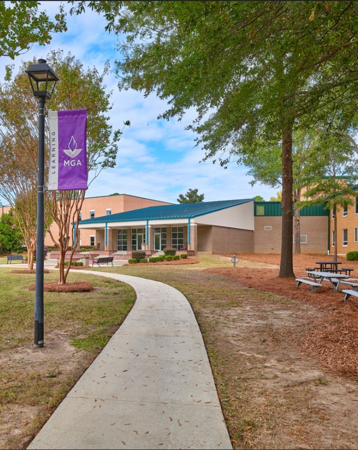 Dublin campus walkway and grassy field.