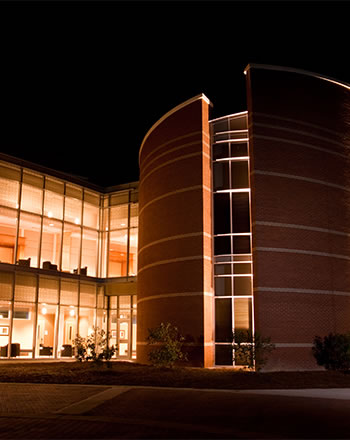 Macon campus at building at night.