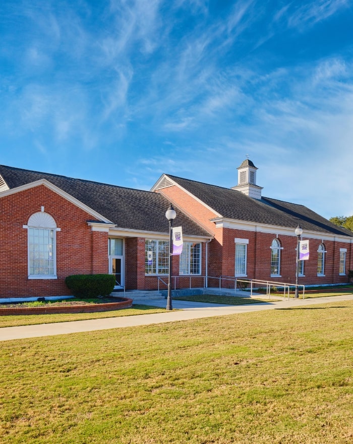 Warner Robins campus building at night.