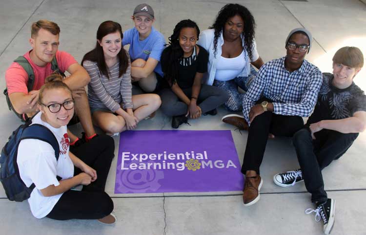 students around the experiential learning logo