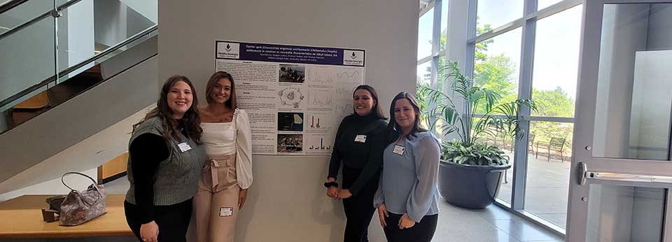 Students in front of a poster