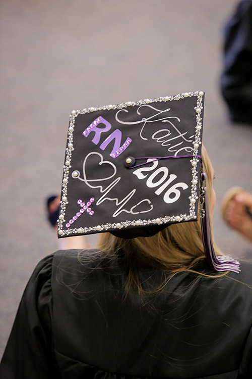 a group of nursing students in caps and gowns