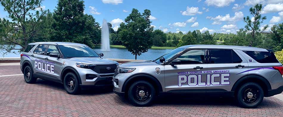 2 MGA Police SUVs