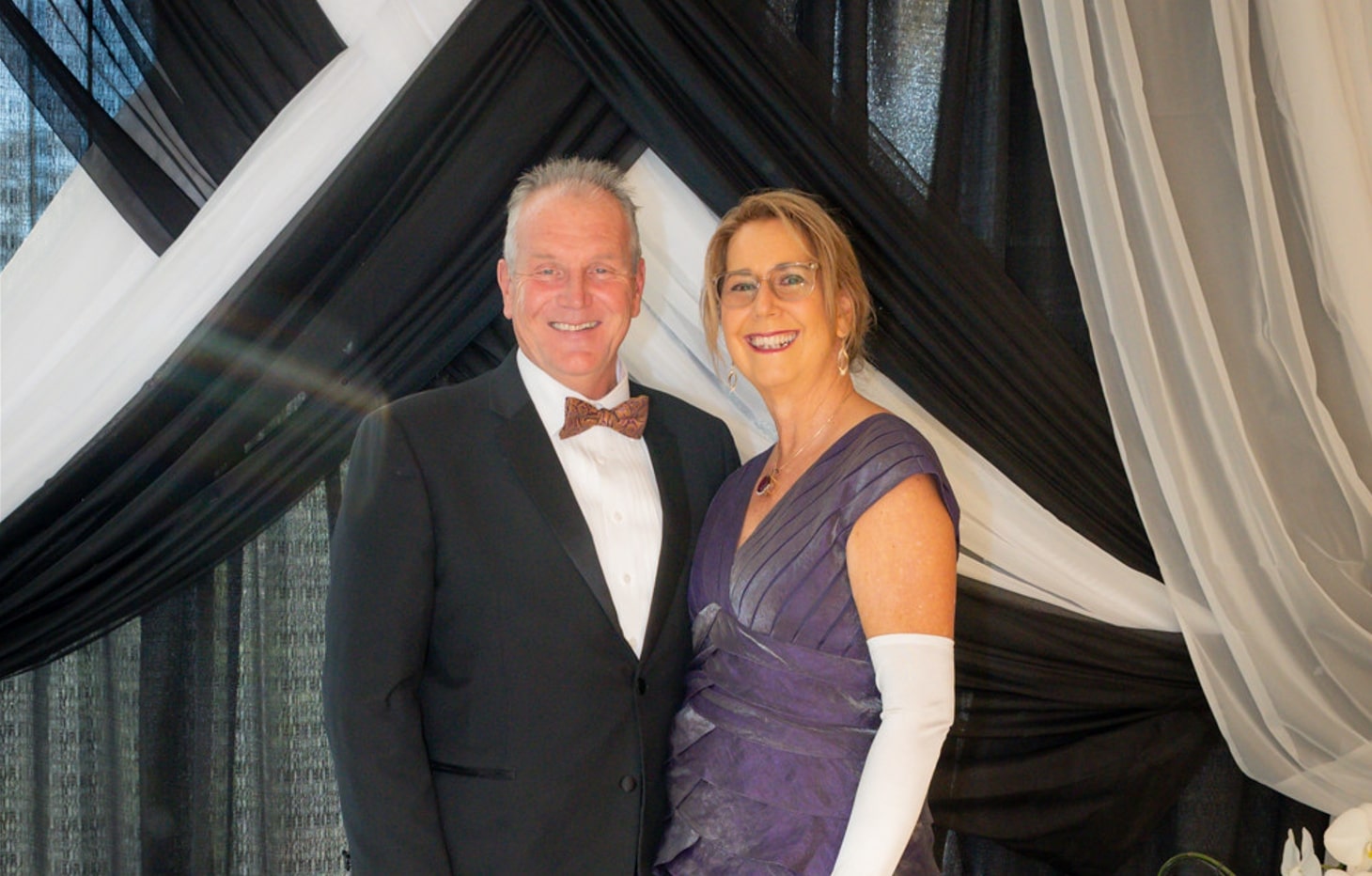 First Lady Melody Blake on the right side of President Christopher Blake at a gala