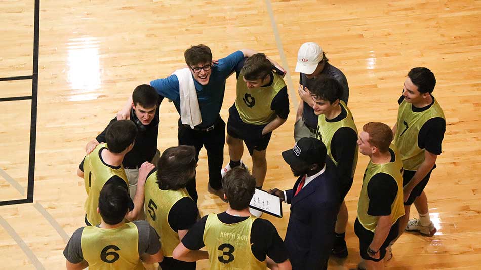 A huddle of students during a basketball game
