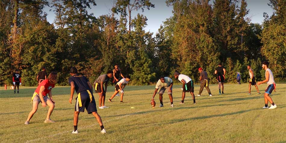 students lined up to play football